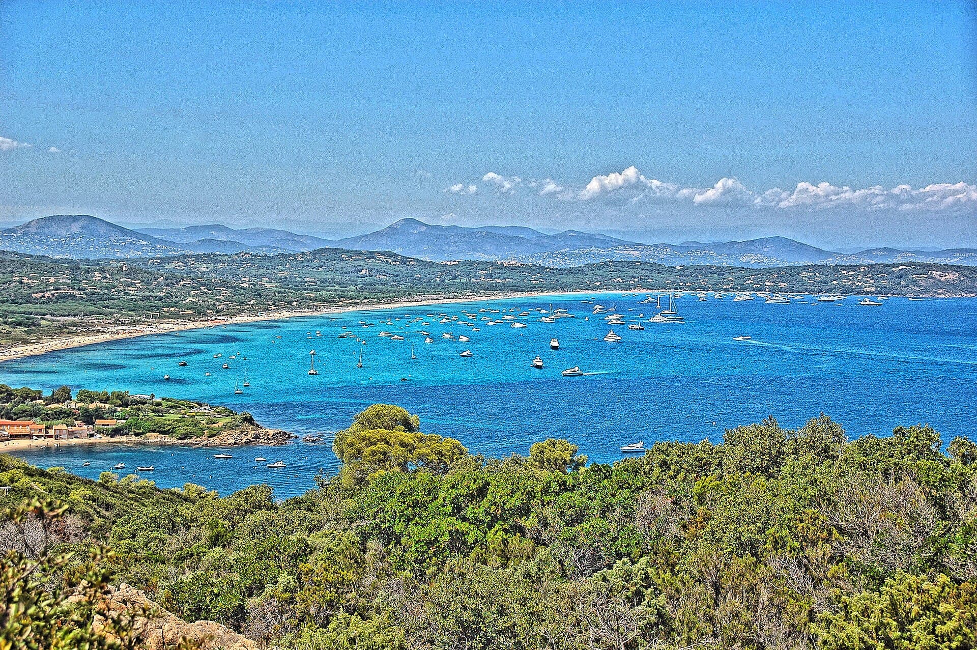Pampelonne beach viewed from the Gulf of Saint-Tropez — boat anchored off Club 55