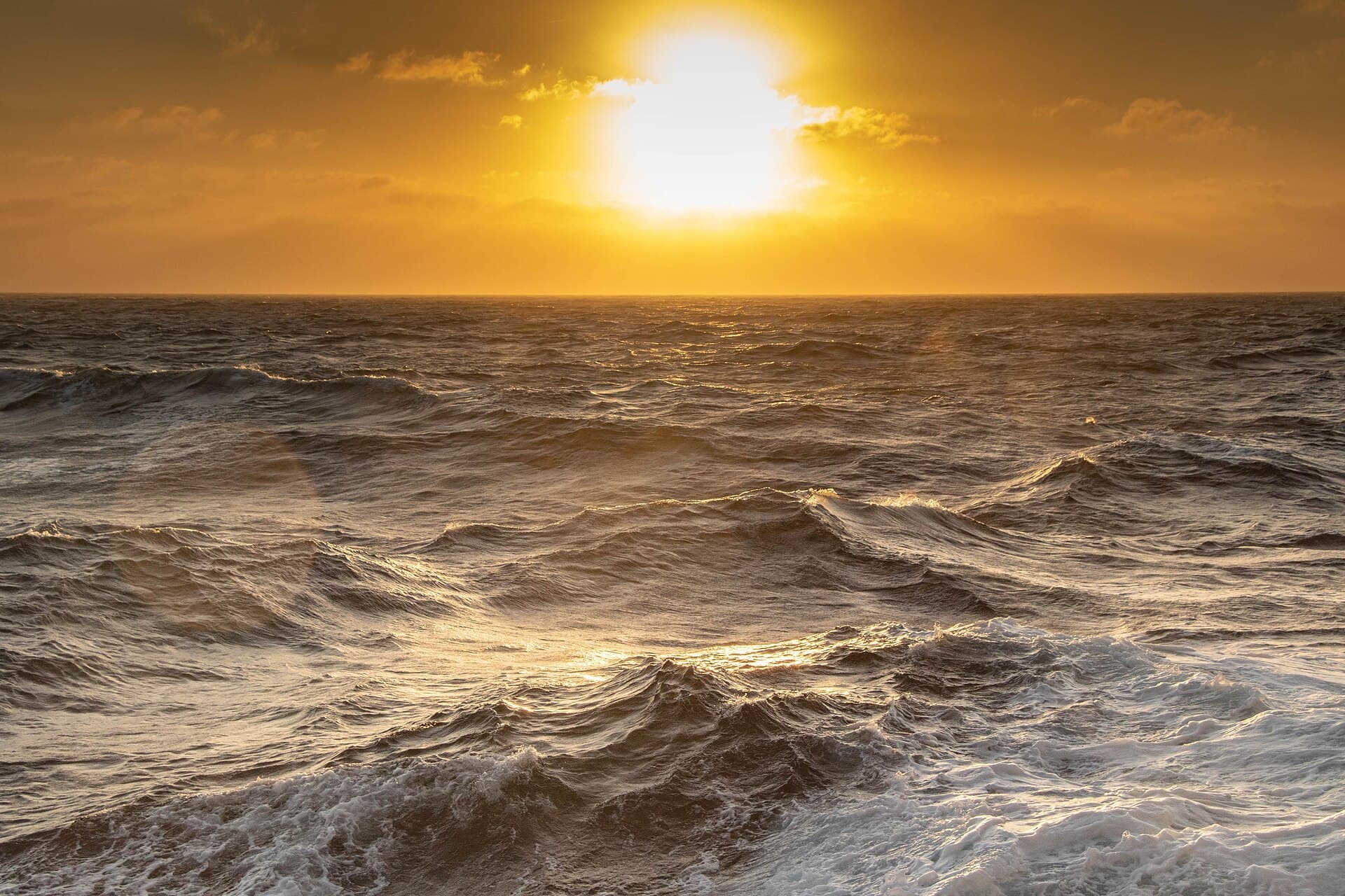 Golden sunset over the Gulf of Saint-Tropez from a boat — Cap Camarat lighthouse